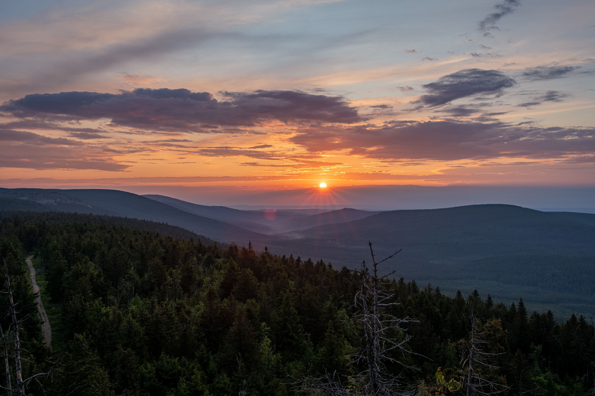 Sunrise over the forested ridges of the Karkonosze mountains near Szklarska Poręba, Poland